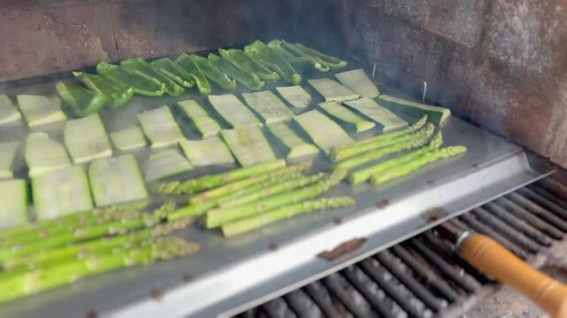 Vegetarian and vegan outdoor barbecue. Grilled peppers, zucchini and asparagus.