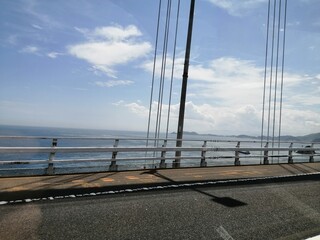 It says "Naruto" in Japanese. In the Naruto Strait, Tokushima Prefecture, Japan, the ocean creates swirling waves due to special tidal currents.