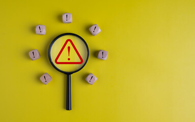Exclamation mark in magnifying glass on yellow background, Warning Sign, danger of malware virus...