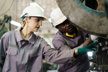 Fototapeta premium A workers or technicians are inspecting the machines.