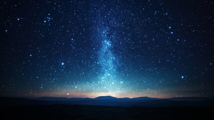 Night sky reveals countless stars over mountains