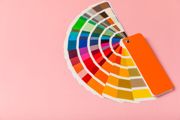 Color palette on a bright colored background. Color palette guide. paper catalog of rainbow color....