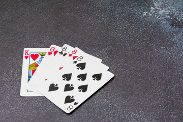 A powerful poker hand featuring four eights (four-of-a-kind) with a King of Hearts as the kicker. A symbol of luck, strategy, and high-stakes gambling, perfect for casino and card game themes.