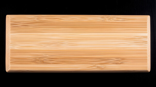 Rectangular bamboo cutting board on black background, ideal for food photography or recipe blogs