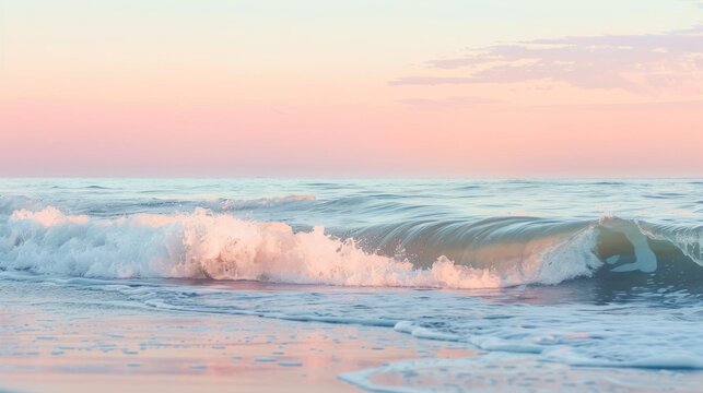Beautiful ocean waves gently rolling onto a sandy beach at sunset