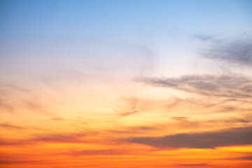 Sky,sunset, beautiful , luxury soft gradient orange gold clouds and sunlight on the blue sky perfect for the background, Sunrise on morning or evening in winter warm time ,Twilight summer,silhouette