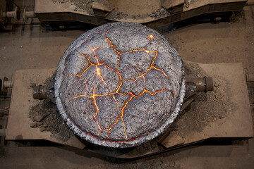 Liquid metal tank pours at the steel mill in iron factory.