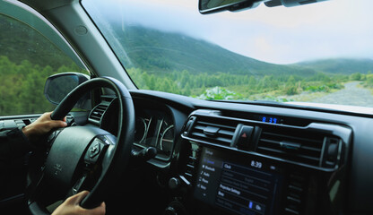 Driving off road car in the high altitude forest mountains © lzf