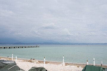 Obraz premium Beautiful aerial view of Garda Lake, wooden pier. No people