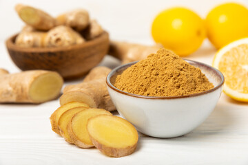 Fresh ginger on wooden background. Dry ginger. Sliced ​​ginger with honey and lemon. Ginger root. Traditional alternative medicine, healing tea for immunity. Seasoning and spices concept. Copy space.