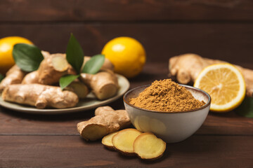 Fresh ginger on wooden background. Dry ginger. Sliced ​​ginger with honey and lemon. Ginger root. Traditional alternative medicine, healing tea for immunity. Seasoning and spices concept. Copy space.