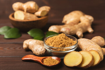 Fresh ginger on wooden background. Dry ginger. Sliced ​​ginger with honey and lemon. Ginger root. Traditional alternative medicine, healing tea for immunity. Seasoning and spices concept. Copy space.