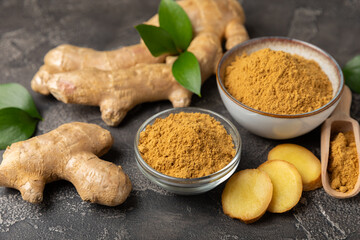 Fresh ginger on wooden background. Dry ginger. Sliced ​​ginger with honey and lemon. Ginger root. Traditional alternative medicine, healing tea for immunity. Seasoning and spices concept. Copy space.