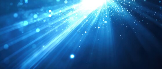 Fototapeta premium Abstract blue light rays with sparkling particles, magical glowing burst of light with bokeh effect, creating a dreamy and ethereal atmosphere