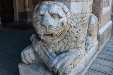 Stone carved Lion on right side of entrance to Church of Saint Paul the Apostle. Ruda Śląska, Poland.