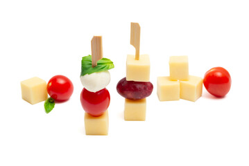 cheese and cherry tomato on a wooden sticks on a white background