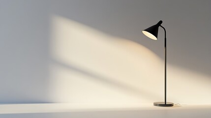 A modern floor lamp emitting light on a plain white wall