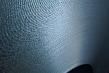 Galvanized steel coil detail and factory background.