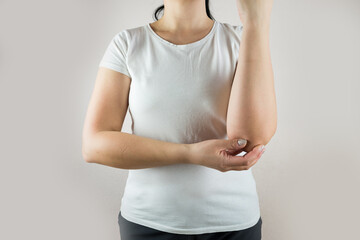 Arm pain and injury for woman. Closeup side body with painful elbow isolated