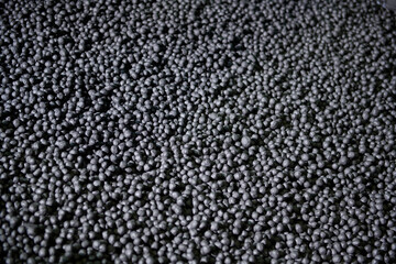 Iron and steel raw material in the factory machine, round small ball shaped.