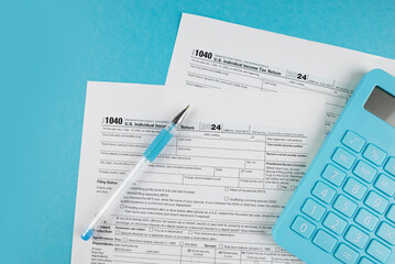 Obraz premium Tax form 1040 on a beautiful blue background, financial document.