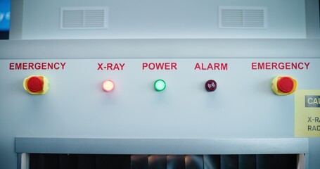 Security Checkpoint in Airport Terminal: Advanced Metal Detector X-ray Scanner with Illuminated Indicators on Control Panel for Luggage Scanning Procedure before Boarding Airplane Flight. Close Up.
