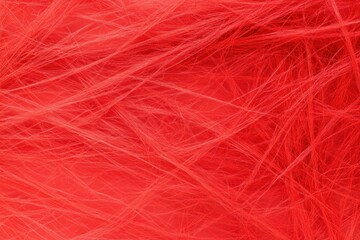 Fototapeta premium A vibrant close up of fine red fibers on a bright red background, symbolizing energy, passion, and creativity, perfect for artistic concepts and design projects