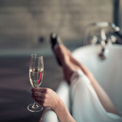 Woman feet in bathrobe at home, closeup