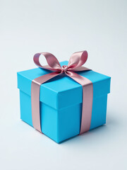 Fototapeta premium A Beautifully Wrapped Blue Gift Box With A Bright Ribbon Bow On A Plain White Background To Promote Festive Occasions.