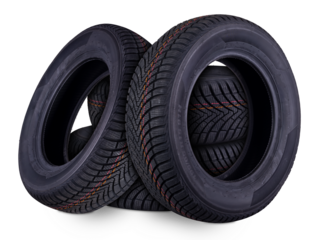 four new all weather season or winter tires car tires stacked isolated  white background. road saftey and transportation service concept