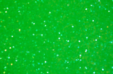 A light green bokeh-style background with defocused light creates an elegant space for text or design elements.