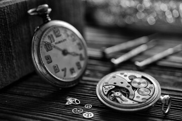A watch maker repairing a vintage automatic watch.