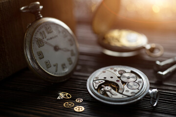 Skilled artisan meticulously repairs a timepiece in a serene workshop filled with intricate tools and clocks