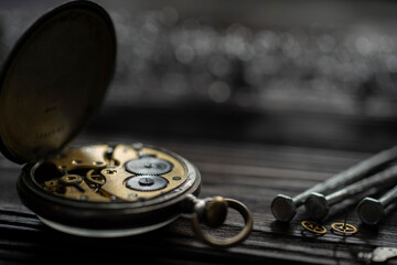 A watch maker repairing a vintage automatic watch.