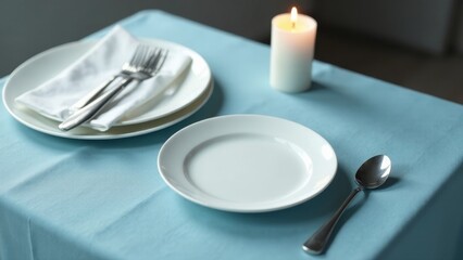 Aromatic candlelight illuminates a delicately set table, featuring pristine white plates, gleaming silverware, and a soft, light-blue tablecloth, creating a serene and inviting ambiance.
