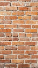Fototapeta premium A textured brick wall featuring a warm, rustic appearance, showcasing a blend of orange and brown shades with visible mortar lines.