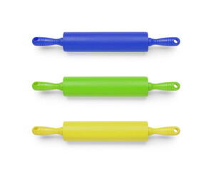 Rolling pins in different colors isolated on white, set