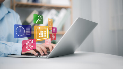 Calendar for monthly appointments and planning, Managing his business schedule, Hand marking dates on virtual calendar, Setting reminders for important appointments, Agenda plan and schedule event.