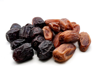Tunisian dates and Ajwa dates isolated on a clean white background