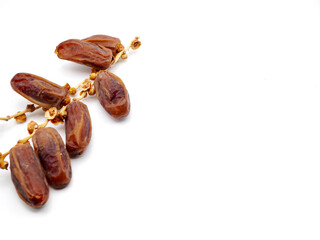 Tunisian dates on a white background. Tunisian dates are a popular variety of dates known for their golden-brown color, soft texture, and naturally sweet taste