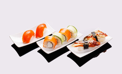 Assorted sushi and maki rolls beautifully arranged on plates