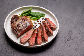 A perfectly cooked sliced striploin steak with a juicy, tender texture