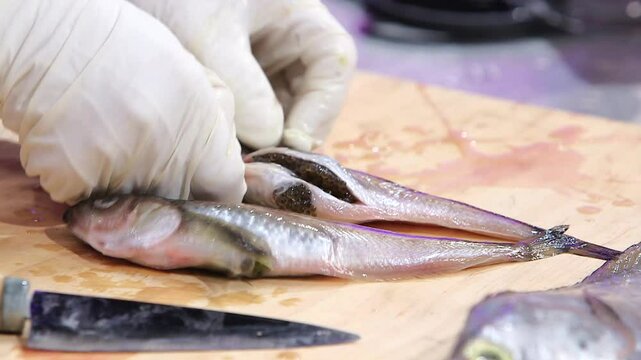 Sailfin sandfish with roe being prepared on a cutting board