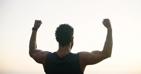 Man, back or fitness with fist pump in nature for workout achievement, goals or success. Male person, athlete or runner with success or winning in sky for performance, exercise or training completion