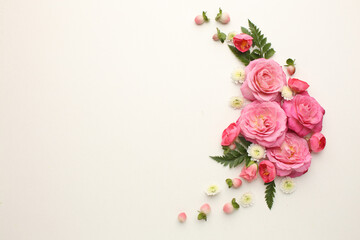 Assorted roses heads. Various soft roses and leaves scattered on a vintage background, overhead view