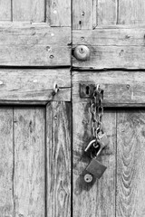 old wooden door with lock in black and white