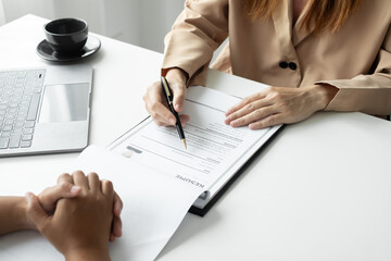 Business people hold a resume and talk to job applicants for job interviews about careers and Their...