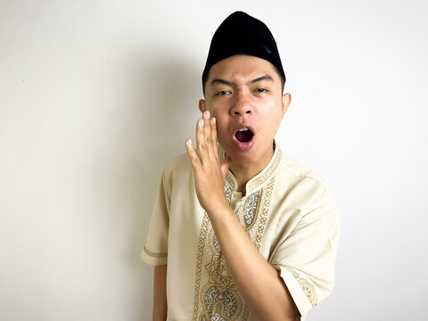 Asian Muslim men in muslim cloth, whispering secrets or gossips over white background