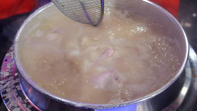 Chicken hotpot boiling in a cauldron