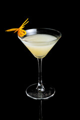 Elegant White Lady cocktail with gin, orange liqueur, and lemon juice, garnished with an orange twist. A refined citrus drink with a smooth taste.